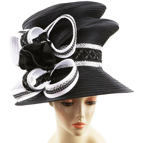 Black and white decorative hat on a mannequin head against a white background