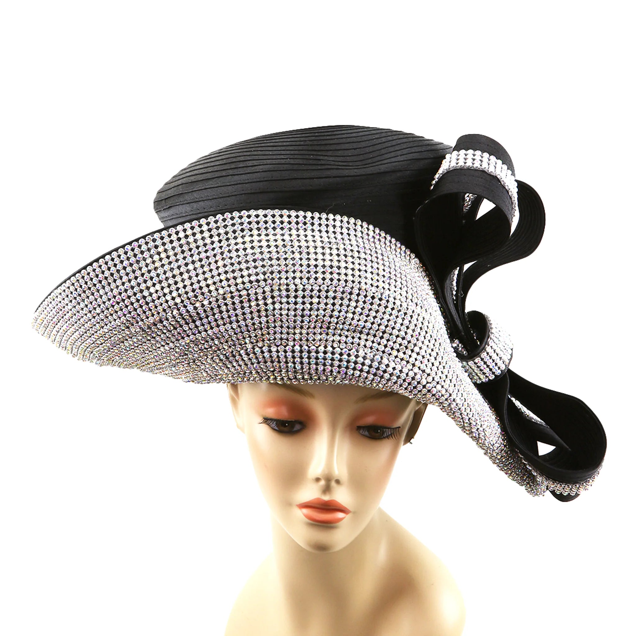Black and silver decorative hat on a mannequin head against a white background